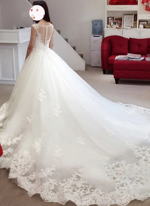 Ball-gown/princess Illusion Sleeveless Cathedral Train Tulle Wedding Dress With Appliqued Lace